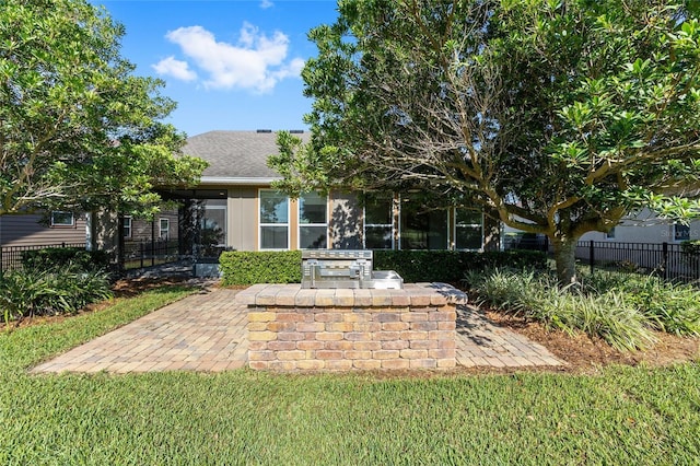 4970 NW 35th Lane Rd, Ocala, FL 34482 - rear view of property featuring a patio and an outdoor kitchen