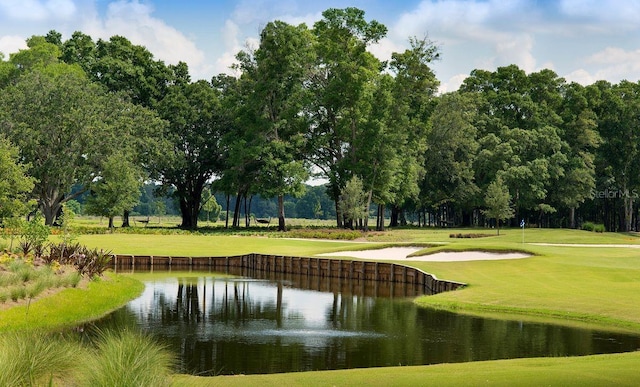 4970 NW 35th Lane Rd, Ocala, FL 34482 - view of home's community featuring a lawn, a water view, view of scattered trees, and view of golf course