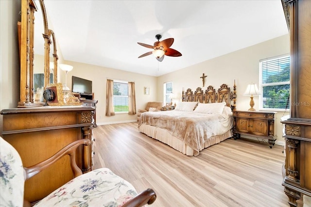 5459 SW 86th St, Ocala, FL 34476 - bedroom with light wood-style floors and ceiling fan