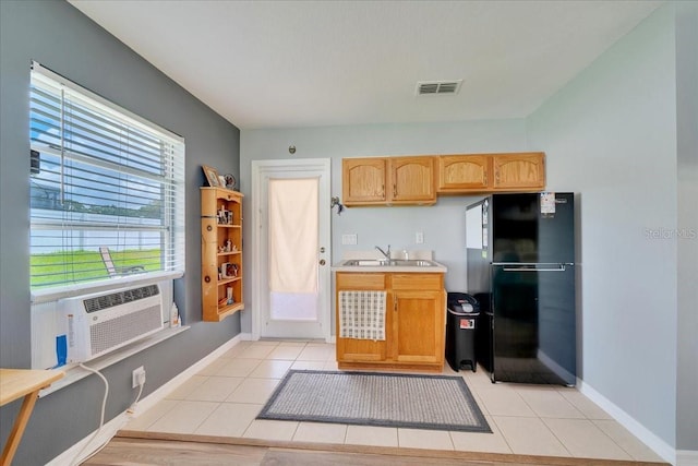5459 SW 86th St, Ocala, FL 34476 - kitchen featuring freestanding refrigerator, light countertops, light tile patterned floors, and light brown cabinetry