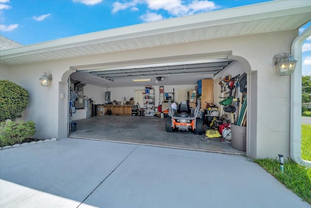 5459 SW 86th St, Ocala, FL 34476 - garage with concrete driveway and a garage door opener