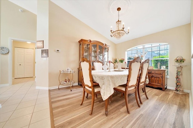 5459 SW 86th St, Ocala, FL 34476 - dining room with a chandelier, light wood finished floors, and high vaulted ceiling