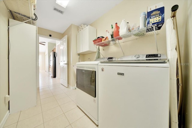 5459 SW 86th St, Ocala, FL 34476 - laundry area with washer and clothes dryer, cabinet space, and light tile patterned floors