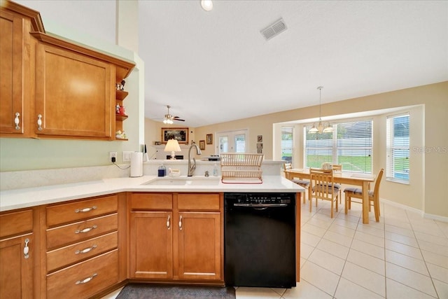 5459 SW 86th St, Ocala, FL 34476 - kitchen with black dishwasher, a peninsula, brown cabinets, light tile patterned flooring, and light countertops