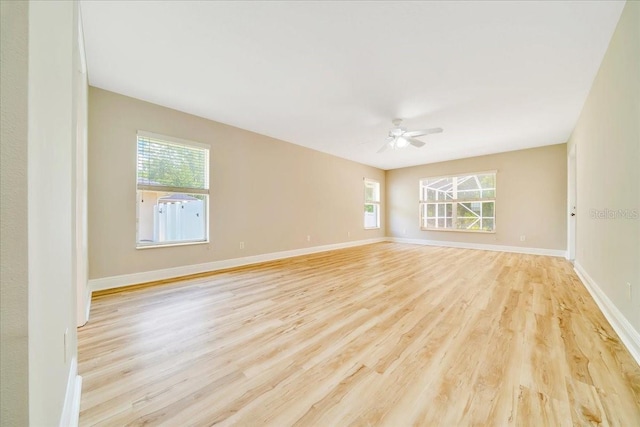 6631 SE 11th Loop, Ocala, FL 34472 - spare room featuring plenty of natural light, light wood-type flooring, and ceiling fan