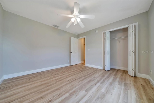 6631 SE 11th Loop, Ocala, FL 34472 - unfurnished bedroom featuring light wood-type flooring, a closet, and a ceiling fan