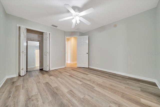6631 SE 11th Loop, Ocala, FL 34472 - unfurnished bedroom with light wood-style floors, ceiling fan, and a closet