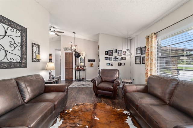 501 Marion Oaks Dr, Ocala, FL 34473 - living area with dark wood-type flooring, vaulted ceiling, ceiling fan, and a textured ceiling
