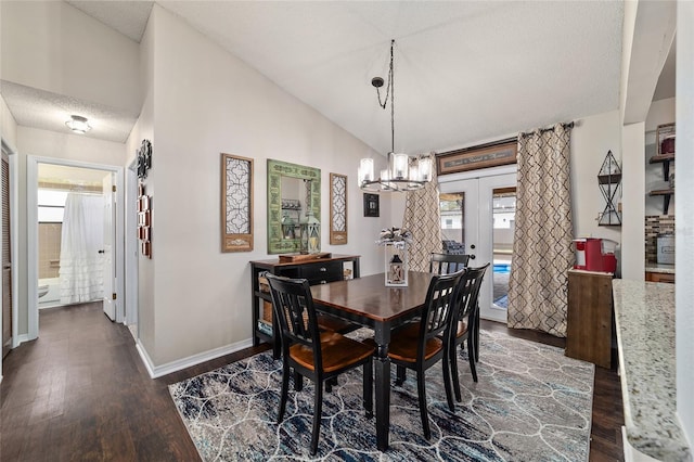 501 Marion Oaks Dr, Ocala, FL 34473 - dining space featuring healthy amount of natural light, dark wood-type flooring, lofted ceiling, a chandelier, and a textured ceiling
