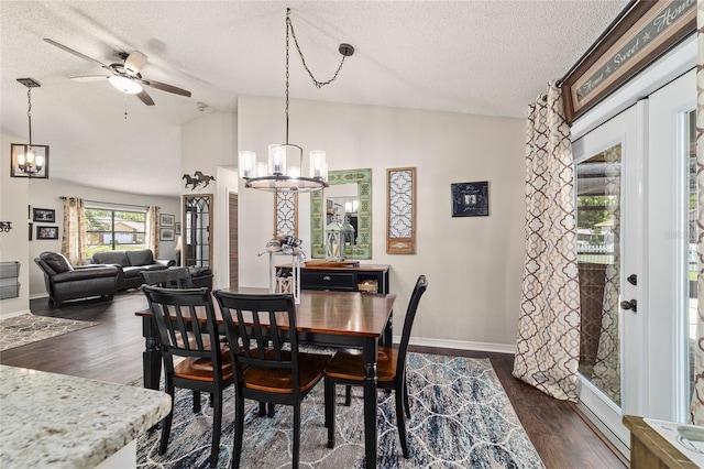501 Marion Oaks Dr, Ocala, FL 34473 - dining room featuring a chandelier, a textured ceiling, vaulted ceiling, dark wood-style flooring, and ceiling fan