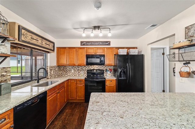 501 Marion Oaks Dr, Ocala, FL 34473 - kitchen featuring black appliances, dark wood-style floors, light stone counters, backsplash, and brown cabinetry