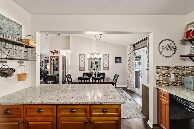 501 Marion Oaks Dr, Ocala, FL 34473 - kitchen with black dishwasher, open shelves, dark wood finished floors, vaulted ceiling, and a peninsula