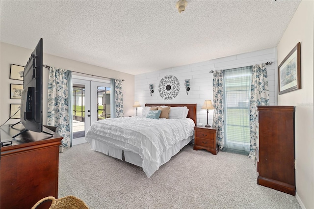 501 Marion Oaks Dr, Ocala, FL 34473 - carpeted bedroom featuring access to exterior, french doors, and a textured ceiling