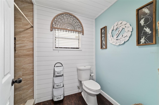 501 Marion Oaks Dr, Ocala, FL 34473 - bathroom featuring wood walls, wood finished floors, and a shower