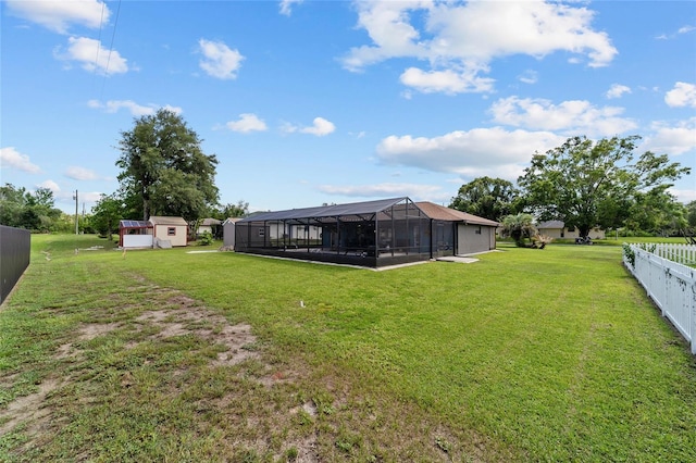 501 Marion Oaks Dr, Ocala, FL 34473 - view of yard featuring a lanai and a storage unit