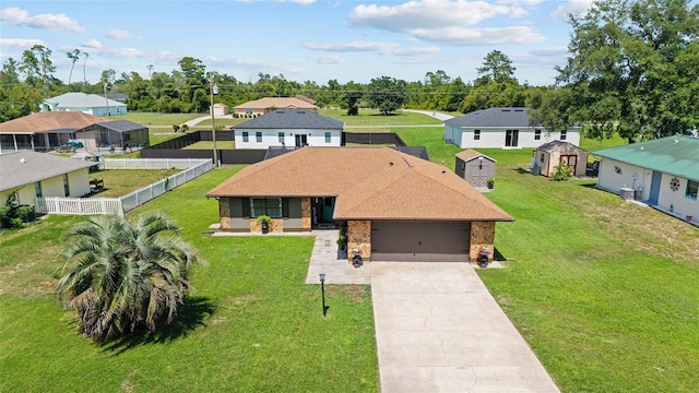 501 Marion Oaks Dr, Ocala, FL 34473 - ranch-style home featuring a fenced backyard, an attached garage, driveway, and a residential view