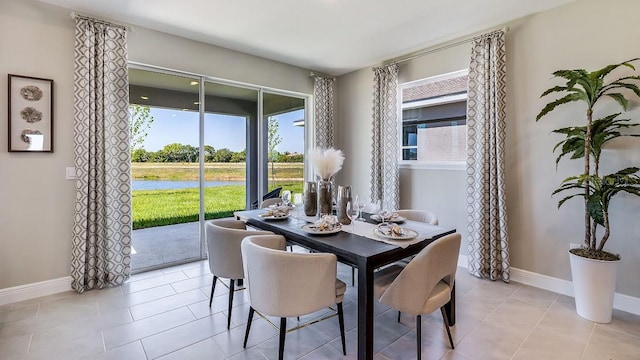4269 SW 54th Street Rd, Ocala, FL 34474 - dining space featuring light tile patterned flooring and a water view