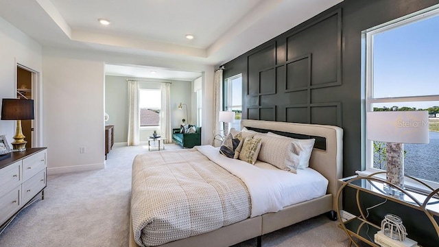 4269 SW 54th Street Rd, Ocala, FL 34474 - bedroom with light colored carpet, a raised ceiling, and recessed lighting