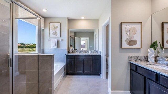 4269 SW 54th Street Rd, Ocala, FL 34474 - full bath featuring healthy amount of natural light, tile patterned flooring, two vanities, and a garden tub