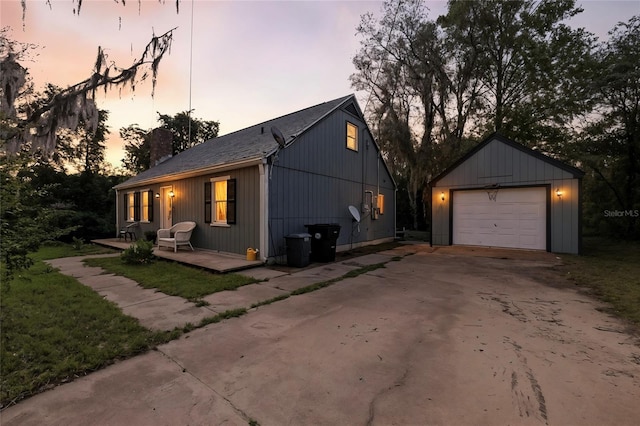 5693 Payette Ave, Keystone Heights, FL 32656 - view of front of home with an outbuilding, a chimney, asphalt driveway, and a garage
