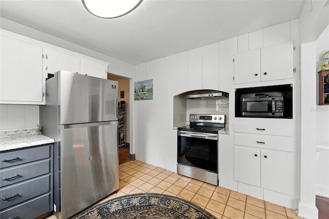 5693 Payette Ave, Keystone Heights, FL 32656 - kitchen featuring stainless steel appliances, ventilation hood, light countertops, and white cabinets