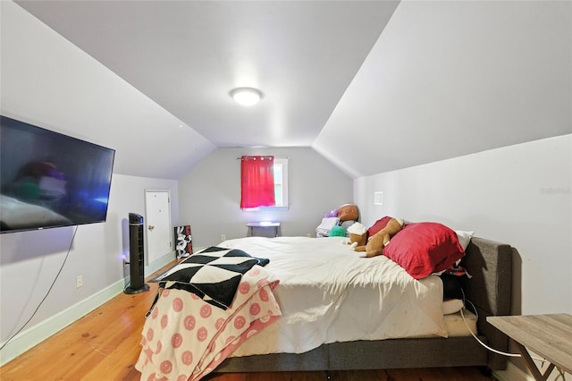 5693 Payette Ave, Keystone Heights, FL 32656 - bedroom with wood finished floors and lofted ceiling