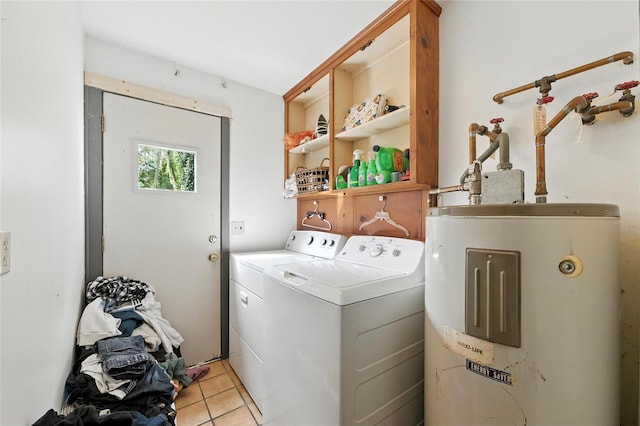 5693 Payette Ave, Keystone Heights, FL 32656 - laundry area featuring electric water heater, independent washer and dryer, and light tile patterned floors