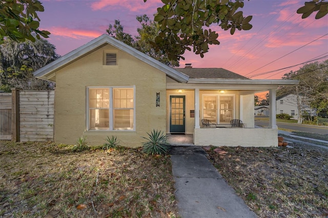 114 NE 11th Ave, Ocala, FL 34470 - bungalow-style house with a porch and stucco siding