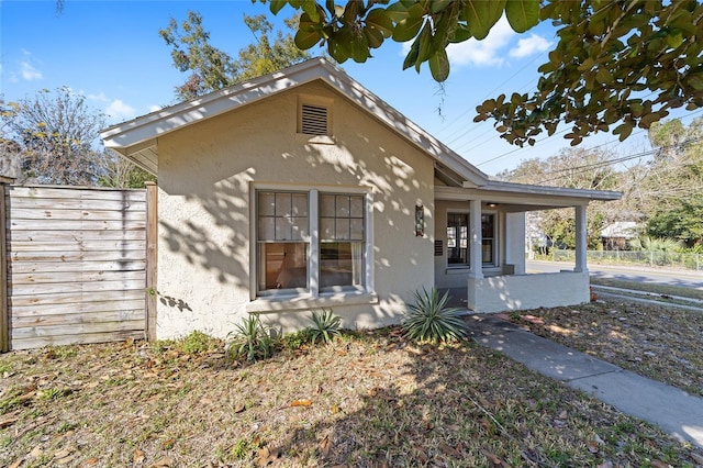 114 NE 11th Ave, Ocala, FL 34470 - view of front of property featuring covered porch and stucco siding