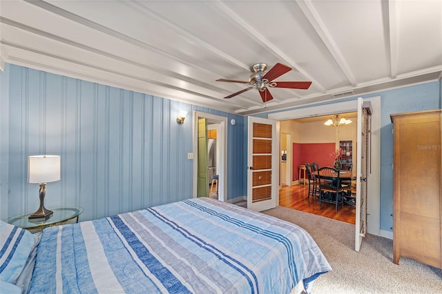 114 NE 11th Ave, Ocala, FL 34470 - carpeted bedroom featuring a chandelier and a ceiling fan