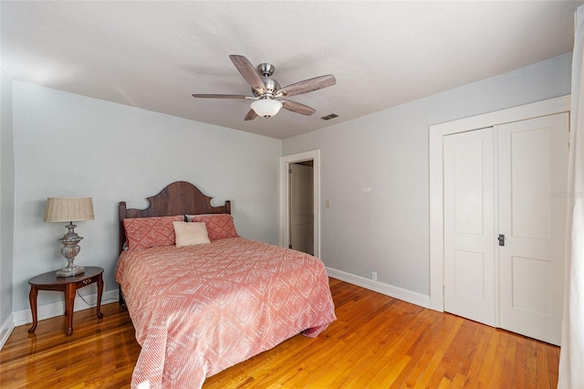 114 NE 11th Ave, Ocala, FL 34470 - bedroom with light wood finished floors, ceiling fan, and a closet