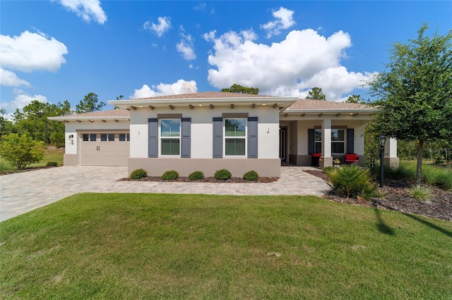 9746 SW 108th Terrace Rd, Ocala, FL 34481 - single story home with decorative driveway, a garage, stucco siding, and a front lawn