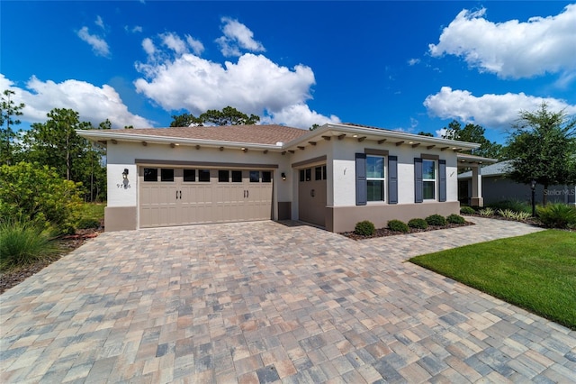 9746 SW 108th Terrace Rd, Ocala, FL 34481 - mediterranean / spanish-style house with decorative driveway, stucco siding, and a garage