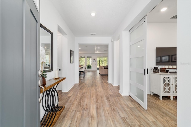 9746 SW 108th Terrace Rd, Ocala, FL 34481 - hallway with light wood-type flooring and recessed lighting