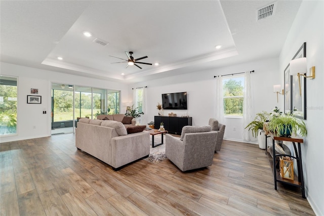 9746 SW 108th Terrace Rd, Ocala, FL 34481 - living room with a tray ceiling, a ceiling fan, wood finished floors, and recessed lighting