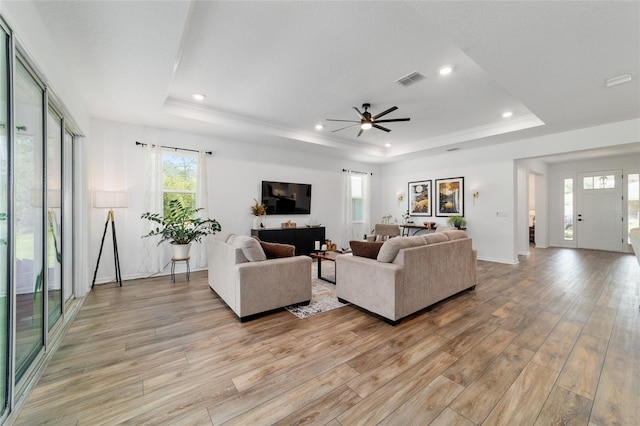 9746 SW 108th Terrace Rd, Ocala, FL 34481 - living room with a tray ceiling, light wood finished floors, recessed lighting, and a ceiling fan
