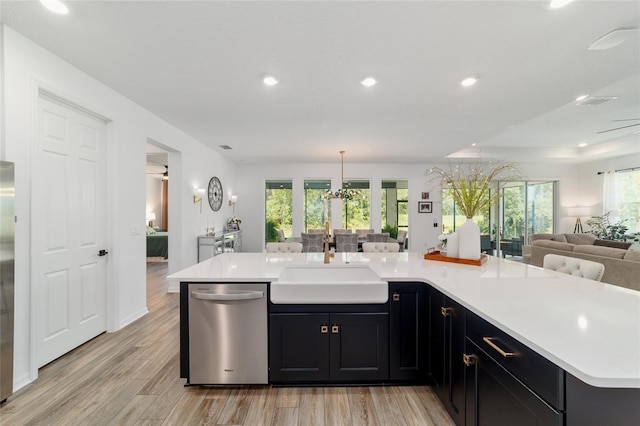 9746 SW 108th Terrace Rd, Ocala, FL 34481 - kitchen featuring appliances with stainless steel finishes, open floor plan, light countertops, light wood-style floors, and recessed lighting