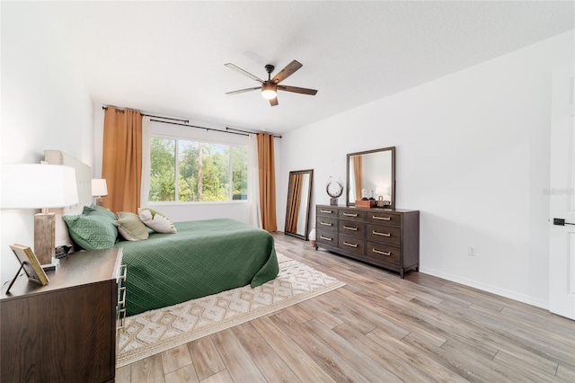 9746 SW 108th Terrace Rd, Ocala, FL 34481 - bedroom featuring light wood-type flooring and a ceiling fan