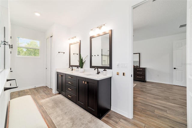 9746 SW 108th Terrace Rd, Ocala, FL 34481 - full bath featuring double vanity and wood finished floors