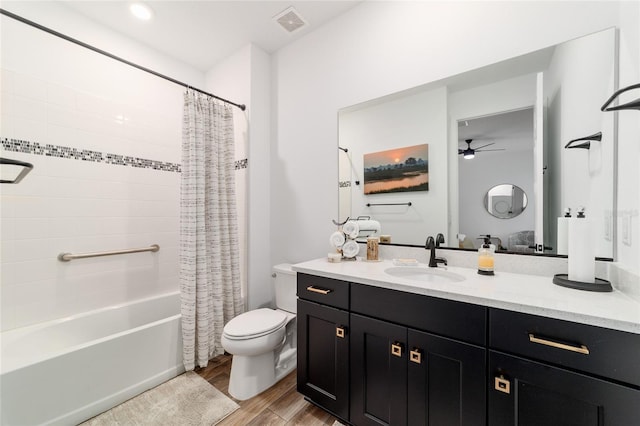 9746 SW 108th Terrace Rd, Ocala, FL 34481 - full bath with vanity, ceiling fan, wood finished floors, and shower / bath combo with shower curtain