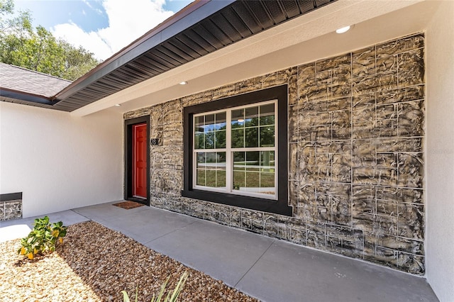 28 Water Track Dr, Ocala, FL 34472 - entrance to property featuring stone siding and stucco siding