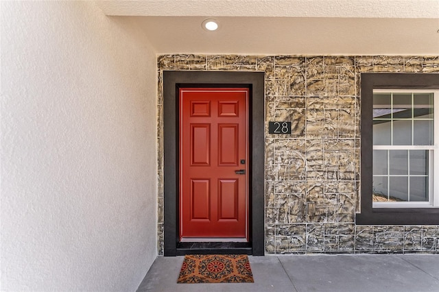 28 Water Track Dr, Ocala, FL 34472 - property entrance featuring stone siding and stucco siding