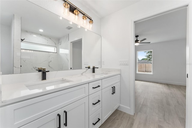 28 Water Track Dr, Ocala, FL 34472 - full bathroom with double vanity, ceiling fan, wood finished floors, and a marble finish shower