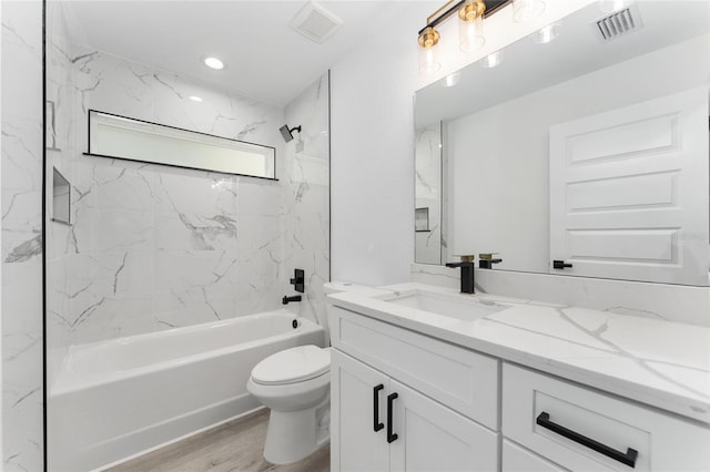 28 Water Track Dr, Ocala, FL 34472 - bathroom featuring vanity, shower / bathtub combination, and wood finished floors