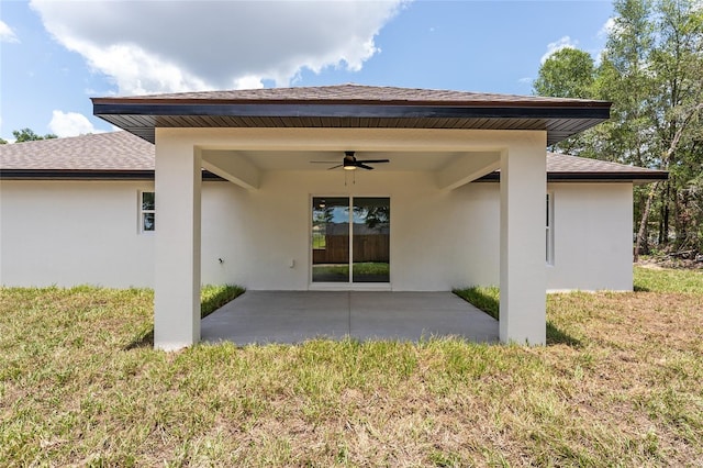 28 Water Track Dr, Ocala, FL 34472 - back of property featuring ceiling fan, a patio area, stucco siding, and a yard