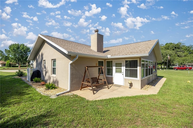 7443 SW 102nd Pl, Ocala, FL 34476 - back of house featuring stucco siding, a chimney, a patio, and a yard