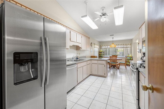 7443 SW 102nd Pl, Ocala, FL 34476 - kitchen with appliances with stainless steel finishes, a ceiling fan, a peninsula, lofted ceiling, and light tile patterned flooring
