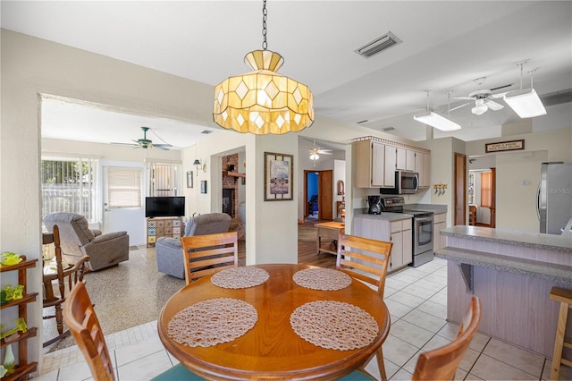 7443 SW 102nd Pl, Ocala, FL 34476 - dining area with a ceiling fan and light tile patterned floors