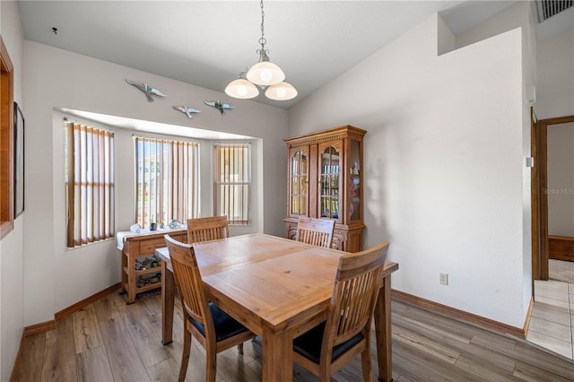 7443 SW 102nd Pl, Ocala, FL 34476 - dining area featuring light wood-style flooring and a chandelier