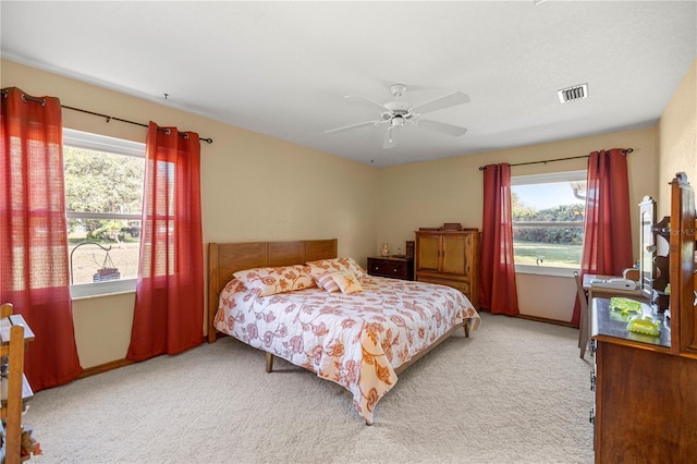 7443 SW 102nd Pl, Ocala, FL 34476 - bedroom with light colored carpet and a ceiling fan